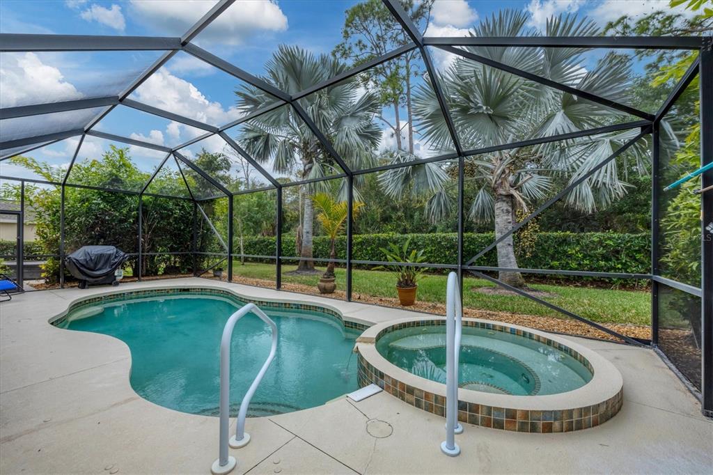 19792 Cobblestone Circle Venice, FL 34292 - Photo 29 of 36 a view of a swimming pool with a backyard