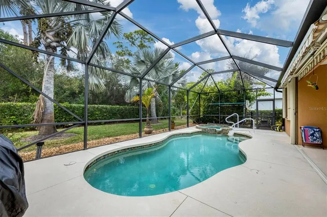 a view of a backyard with swimming pool