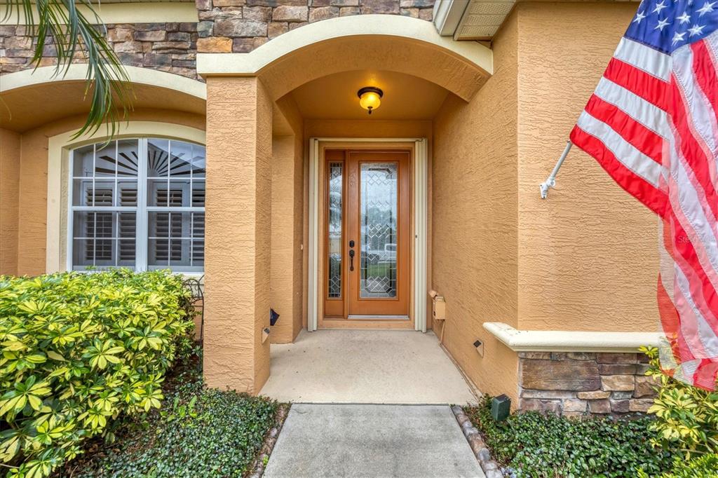 19792 Cobblestone Circle Venice, FL 34292 - Photo 3 of 36 a front view of a house with a yard