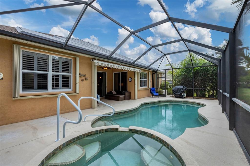 19792 Cobblestone Circle Venice, FL 34292 - Photo 32 of 36 a view of a swimming pool with a patio