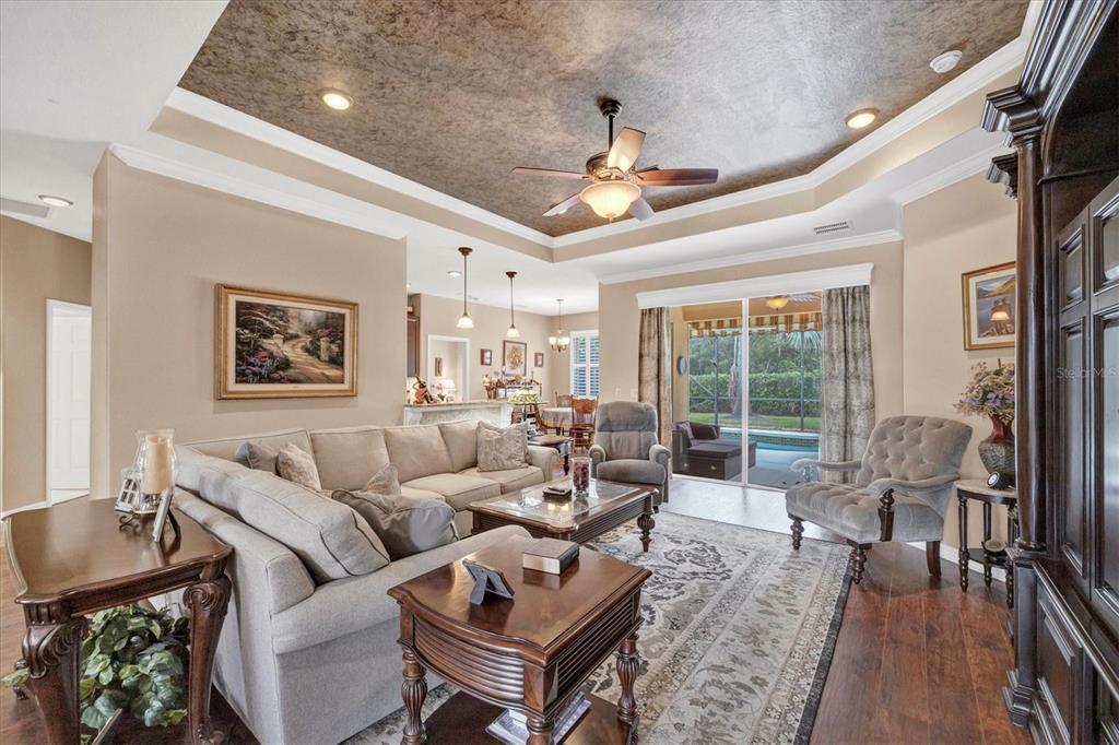19792 Cobblestone Circle Venice, FL 34292 - Photo 7 of 36 a living room with furniture and a large window
