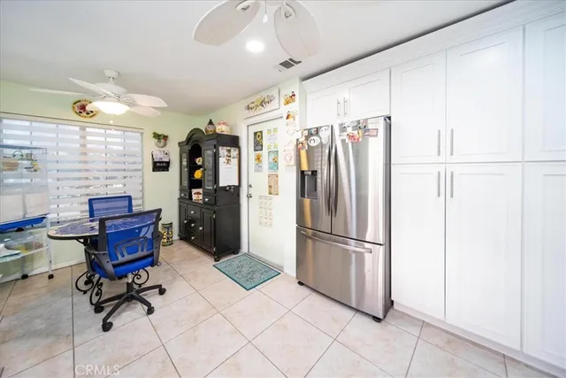 a view of a dining room with furniture and a window
