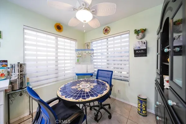 a bedroom with a large bed a flat tv screen and dresser