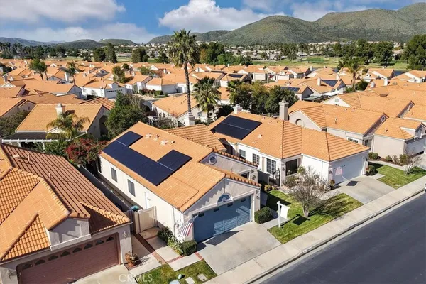 an aerial view of residential houses with outdoor space
