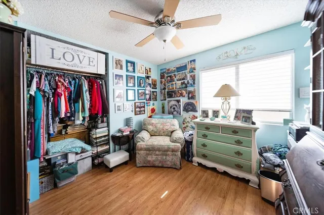 a view of a hallway with wooden floor and entryway