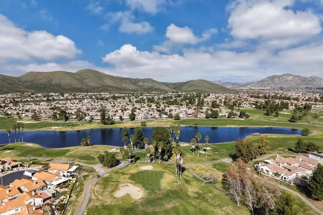 a view of a front of a house with a yard