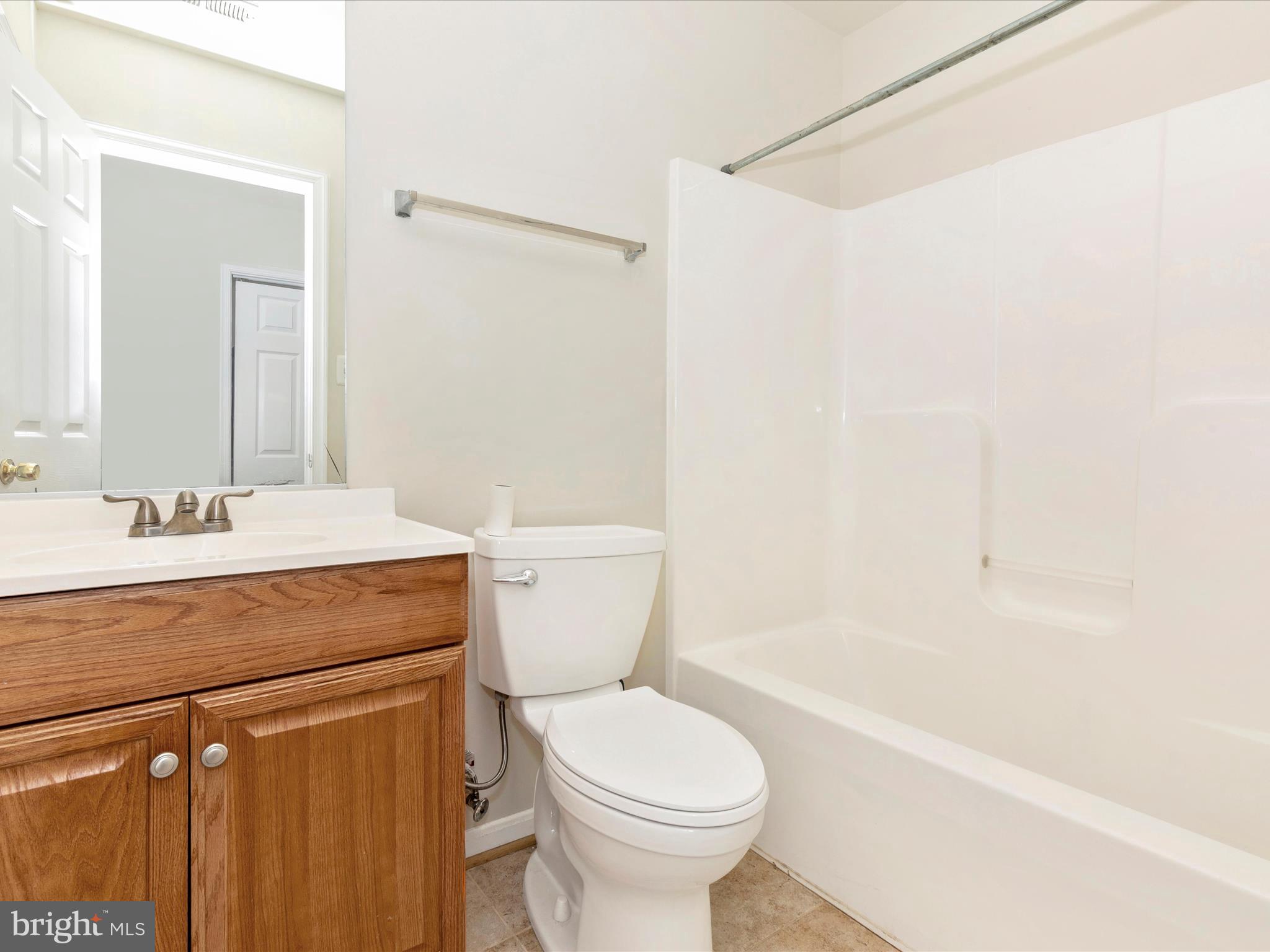2534 Emerson Drive Frederick, MD 21702 - Photo 12 of 55 a bathroom with a sink a toilet and a bathtub