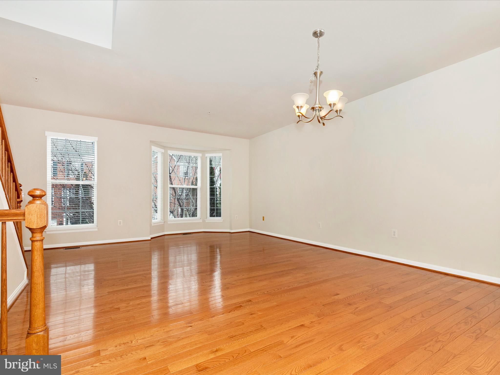 2534 Emerson Drive Frederick, MD 21702 - Photo 17 of 55 a view of an empty room with wooden floor and a window