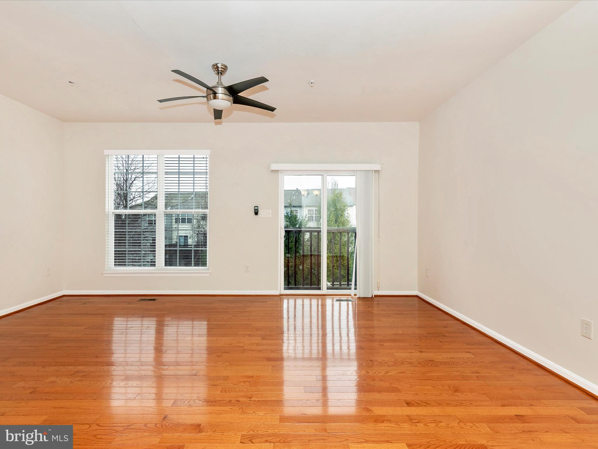 2534 Emerson Drive Frederick, MD 21702 - Photo 21 of 55 a view of an empty room with wooden floor and a window
