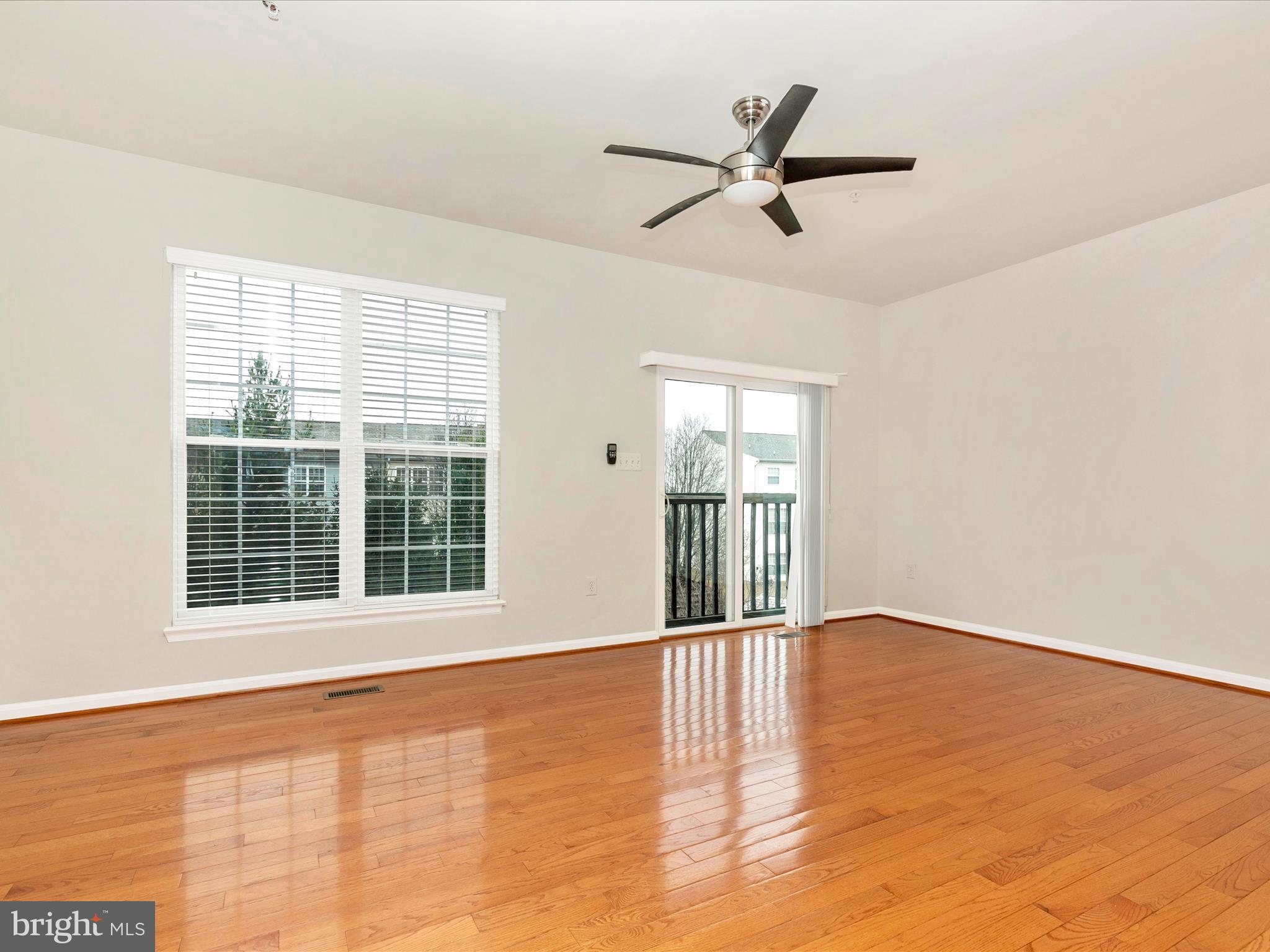 2534 Emerson Drive Frederick, MD 21702 - Photo 28 of 55 a view of an empty room with a window and wooden floor