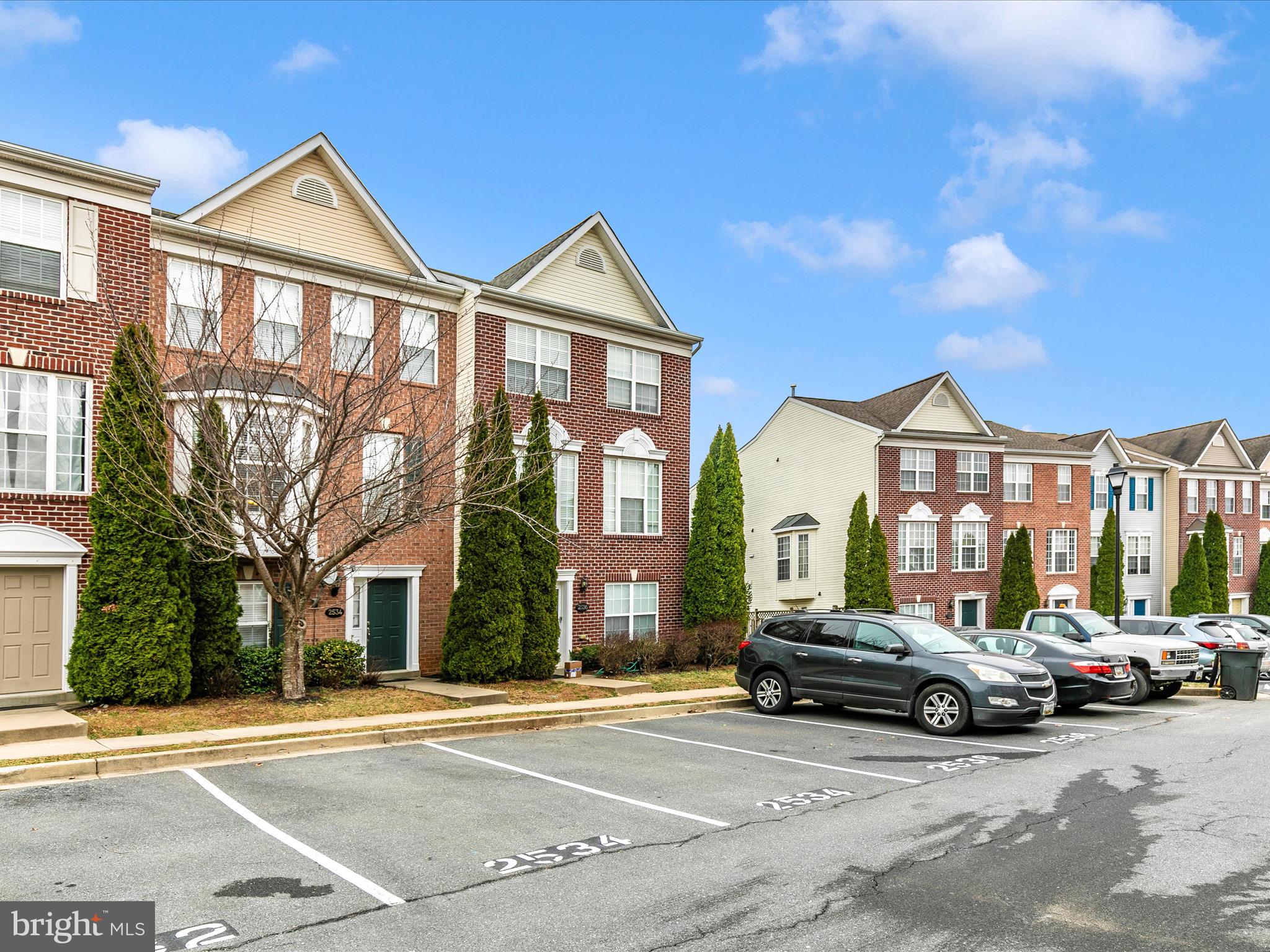 2534 Emerson Drive Frederick, MD 21702 - Photo 3 of 55 a front view of a residential apartment building with a yard