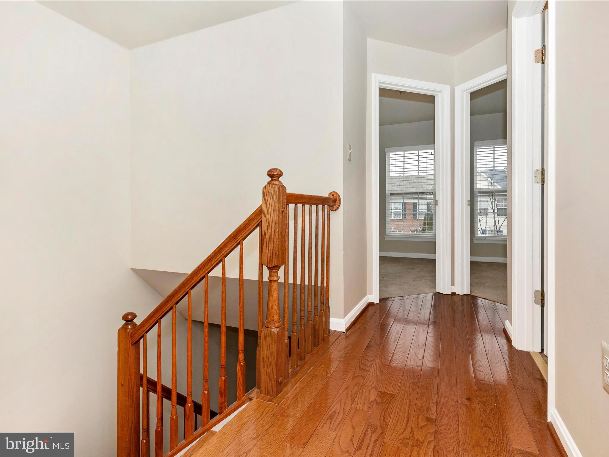 2534 Emerson Drive Frederick, MD 21702 - Photo 40 of 55 a view of a hallway with wooden floor and staircase