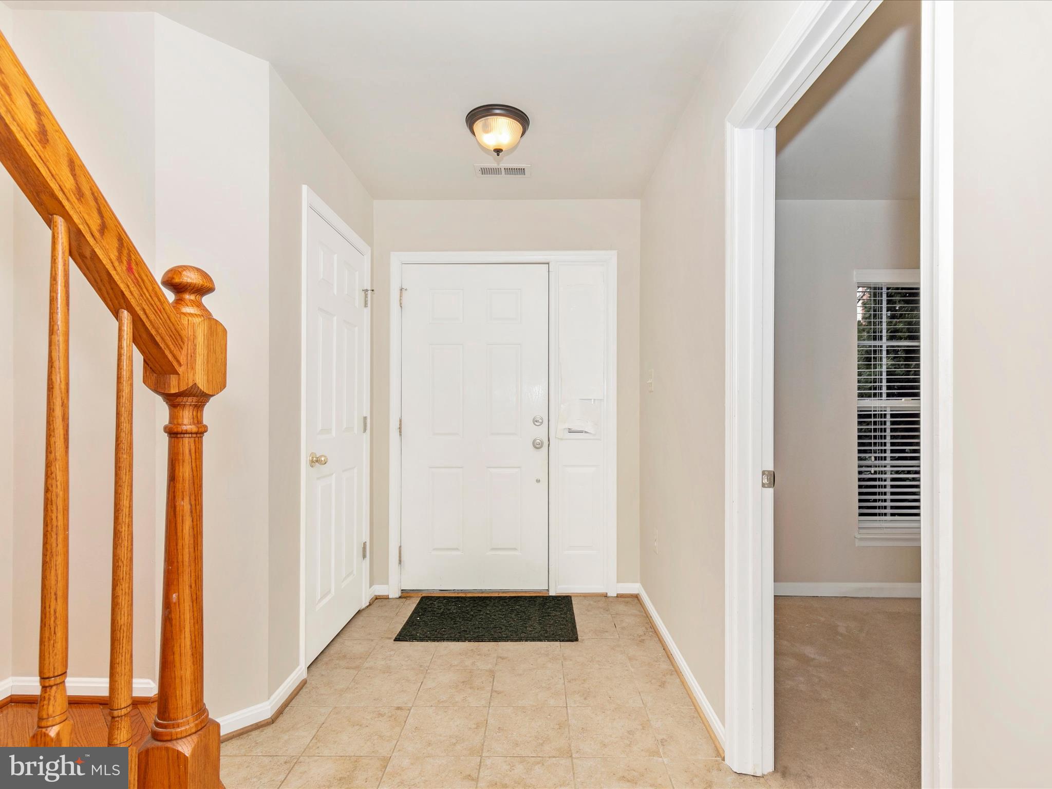2534 Emerson Drive Frederick, MD 21702 - Photo 9 of 55 a view of a hallway with wooden floor and staircase