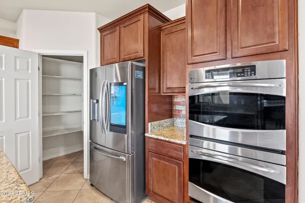 a kitchen with stainless steel appliances a stove a microwave and sink