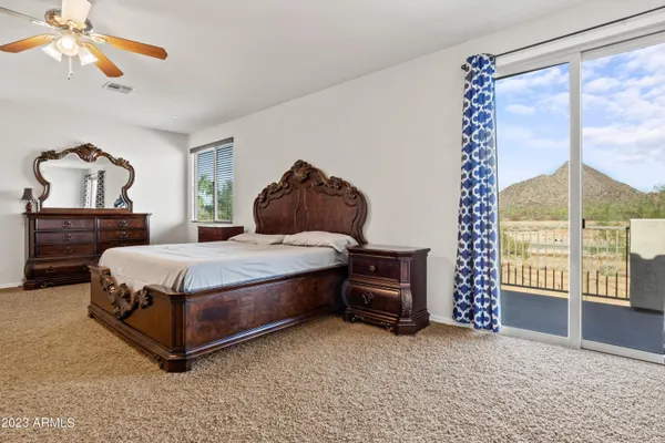 a bedroom with a bed dresser and a window