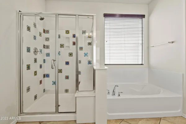 a bathroom with a sink vanity and a mirror