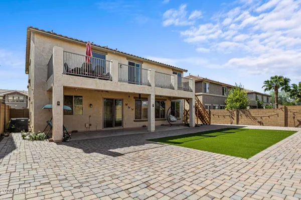 a view of a porch with furniture and a yard