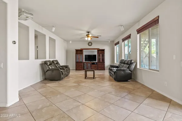 a living room with couches and painting on the wall