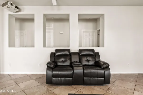 a living room with a large window and a flat screen tv
