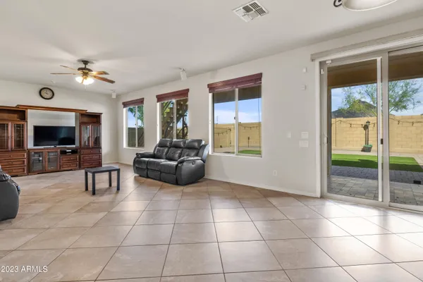 a kitchen with stainless steel appliances granite countertop a refrigerator a sink a stove a oven and a refrigerator