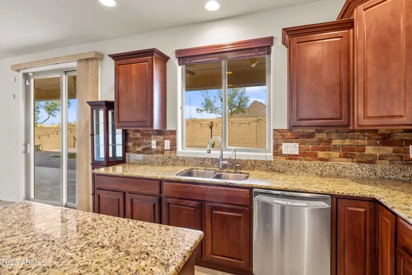 a kitchen with stainless steel appliances and cabinets