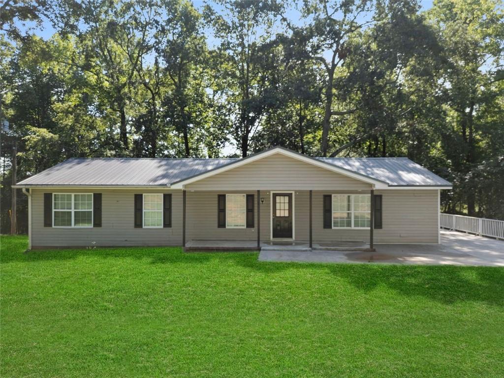 214 Cedar Drive Commerce, GA 30529 - Photo 1 of 1 a view of a house with a yard potted plants and large tree