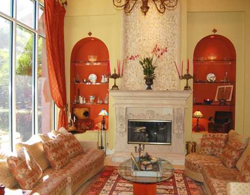 5876 Windsor Terrace Boca Raton, FL 33496 - Photo 2 of 16 a living room with furniture a fireplace and a floor to ceiling window