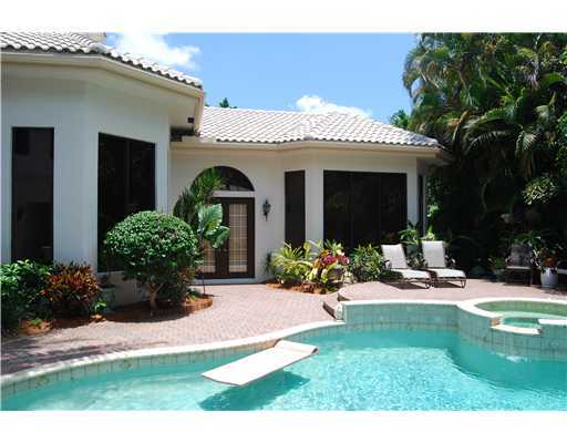 5876 Windsor Terrace Boca Raton, FL 33496 - Photo 4 of 16 a view of a house with garden and plants