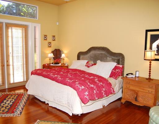 5876 Windsor Terrace Boca Raton, FL 33496 - Photo 6 of 16 a bedroom with a bed and wooden floor