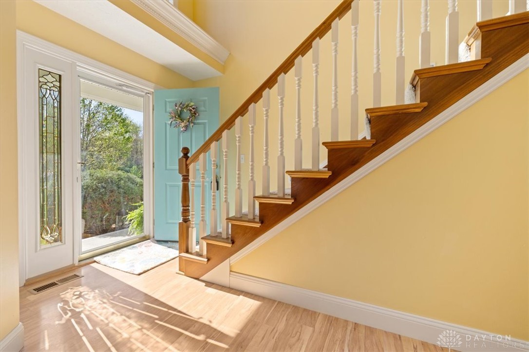 841 Willow Road Springfield, OH 45502 - Photo 3 of 64 The bright entry welcomes you home with a staircase and inviting entryway.