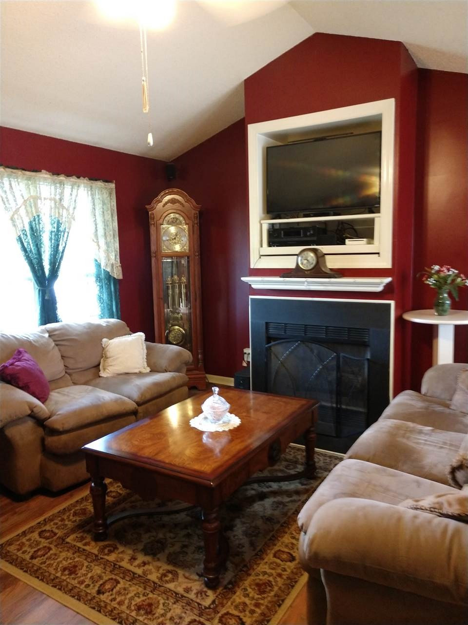 51 Starline Road Selma, NC 27576 - Photo 3 of 16 Note fireplace and cathedral ceiling and fan Living Room