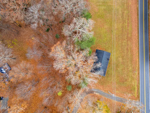 an aerial view of residential house and outdoor space