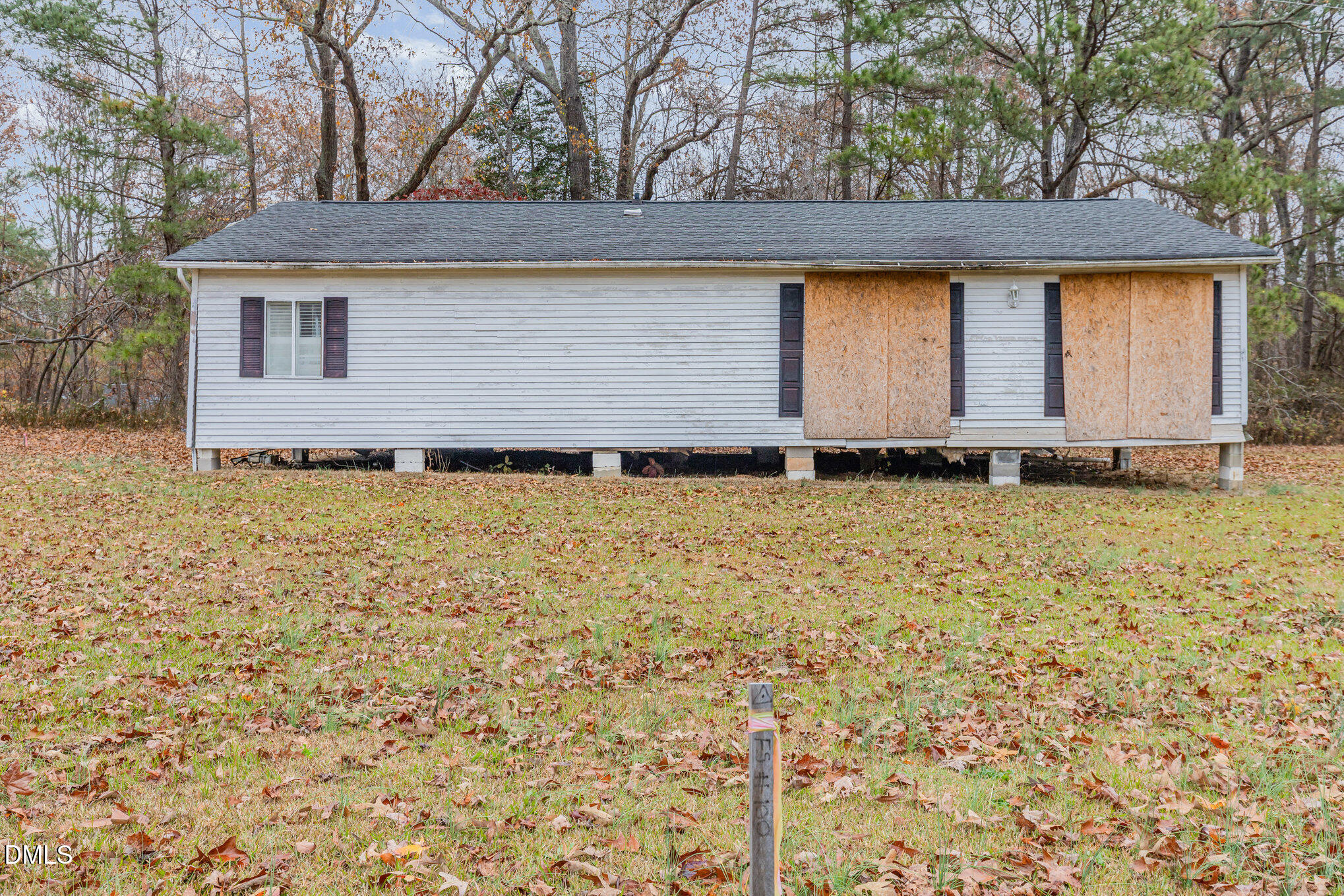 6801 Rock Service Station Road Raleigh, NC 27603 - Photo 30 of 35 a front view of a house with a garden