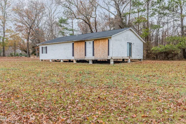 a backyard of a house with lots of green space