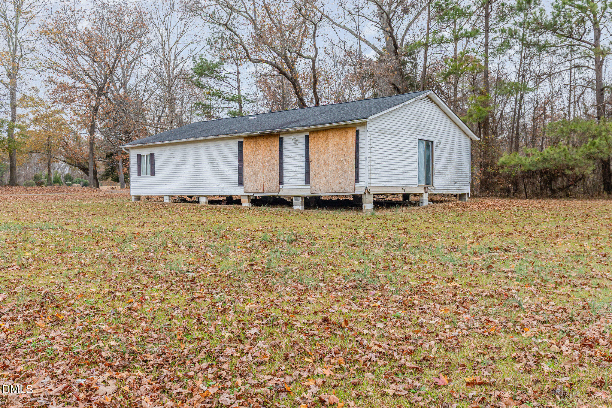 6801 Rock Service Station Road Raleigh, NC 27603 - Photo 31 of 35 a view of a house with a yard