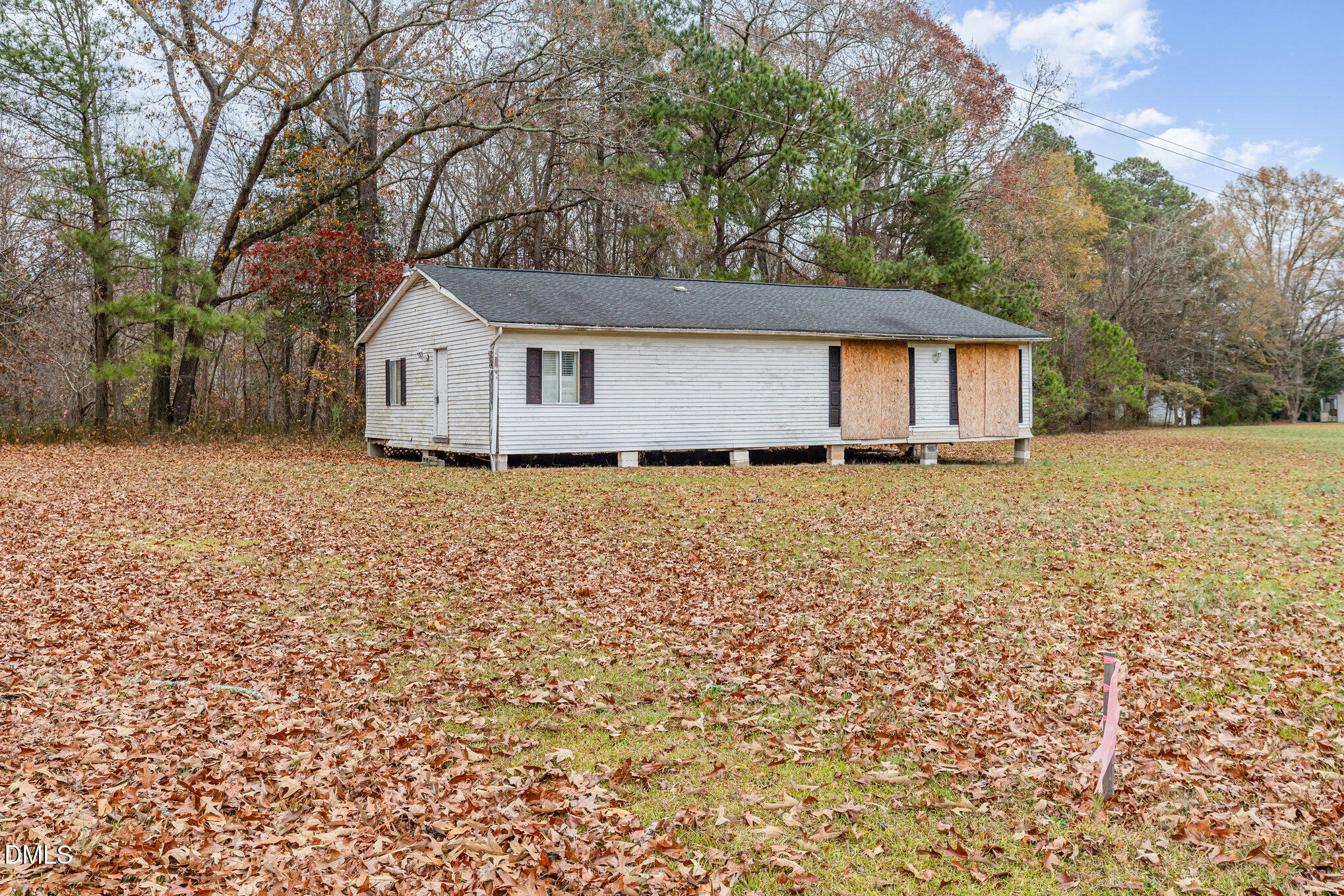 6801 Rock Service Station Road Raleigh, NC 27603 - Photo 33 of 35 front view of house with a yard