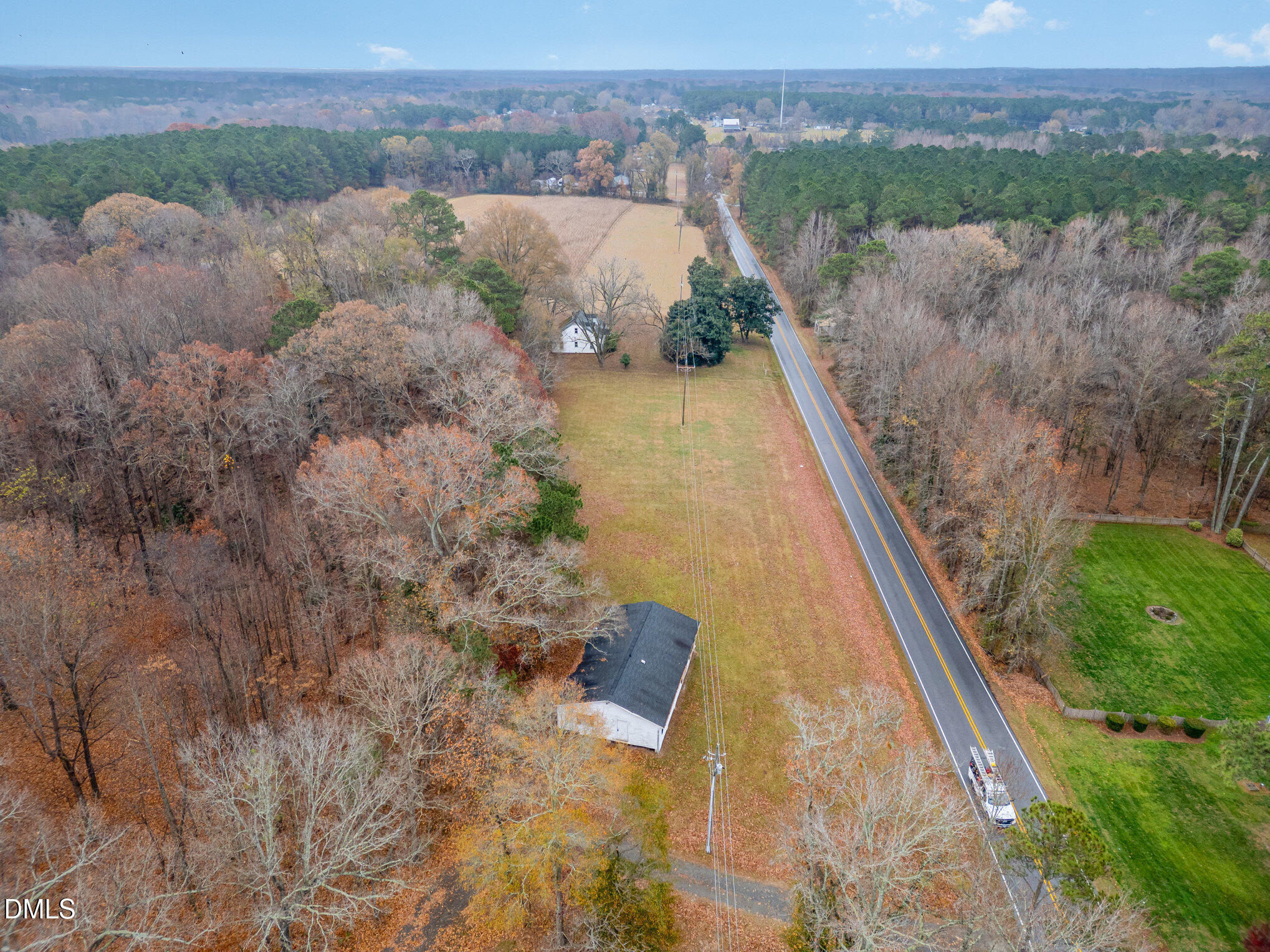 6801 Rock Service Station Road Raleigh, NC 27603 - Photo 4 of 35 a view of a lake with a mountain in the background