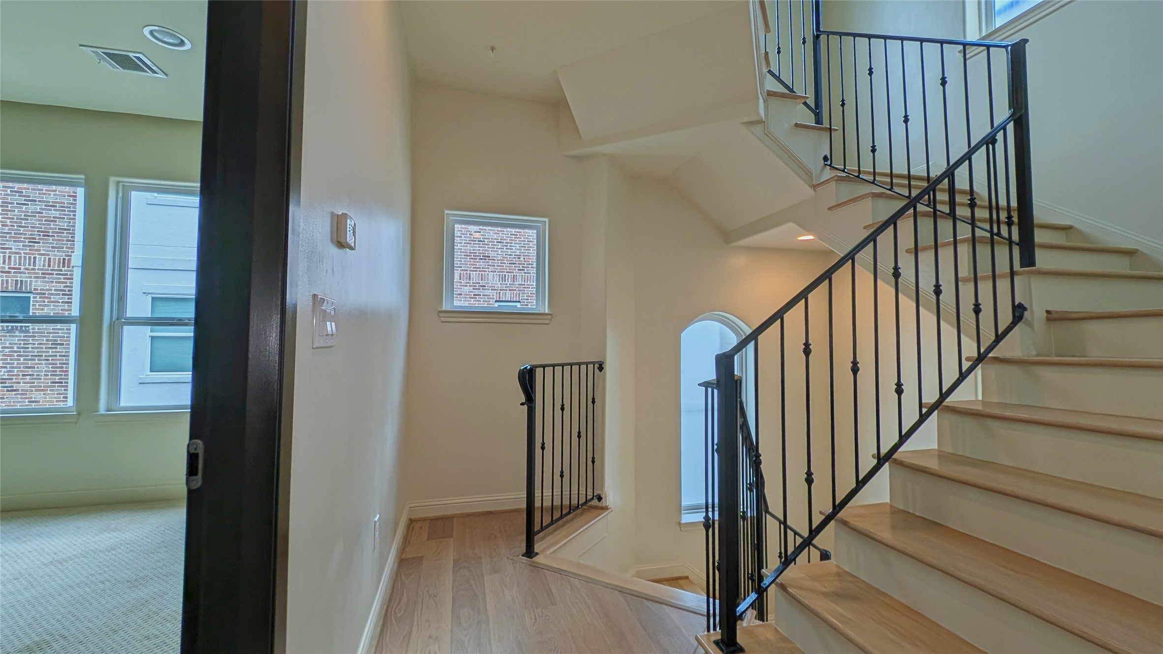 1844 Colquitt Street Houston, TX 77098 - Photo 15 of 40 a view of staircase with wooden floor and a rug