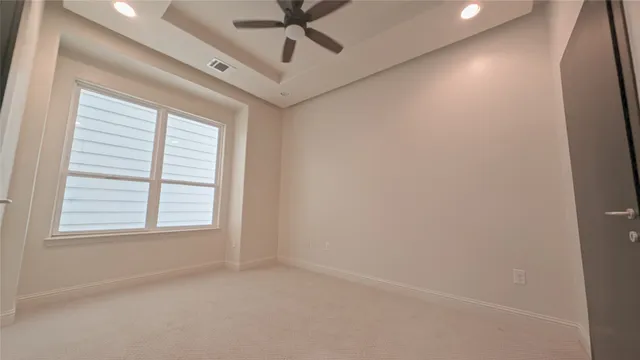 a bathroom with a granite countertop sink a toilet and bathtub