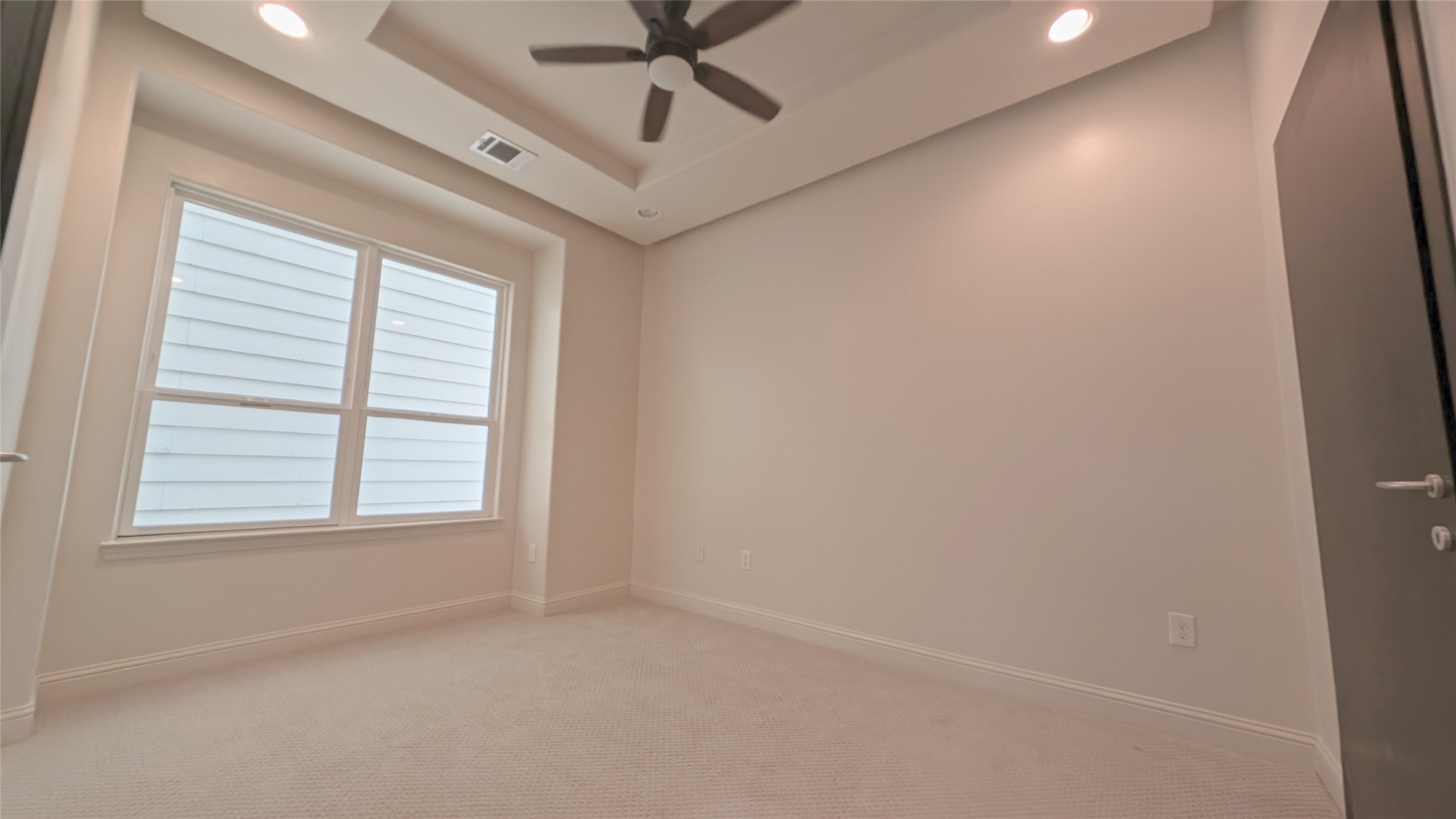1844 Colquitt Street Houston, TX 77098 - Photo 24 of 40 an empty room with a window and a fan
