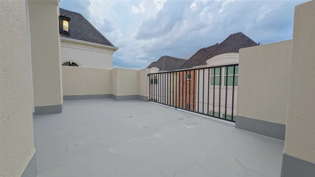 an empty room with a ceiling fan and carpet