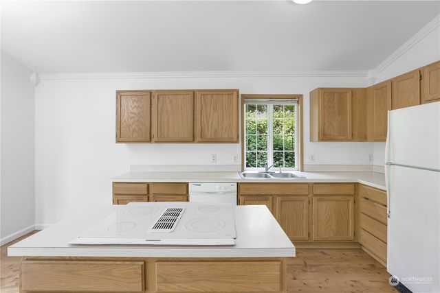 a kitchen with a cabinets and window