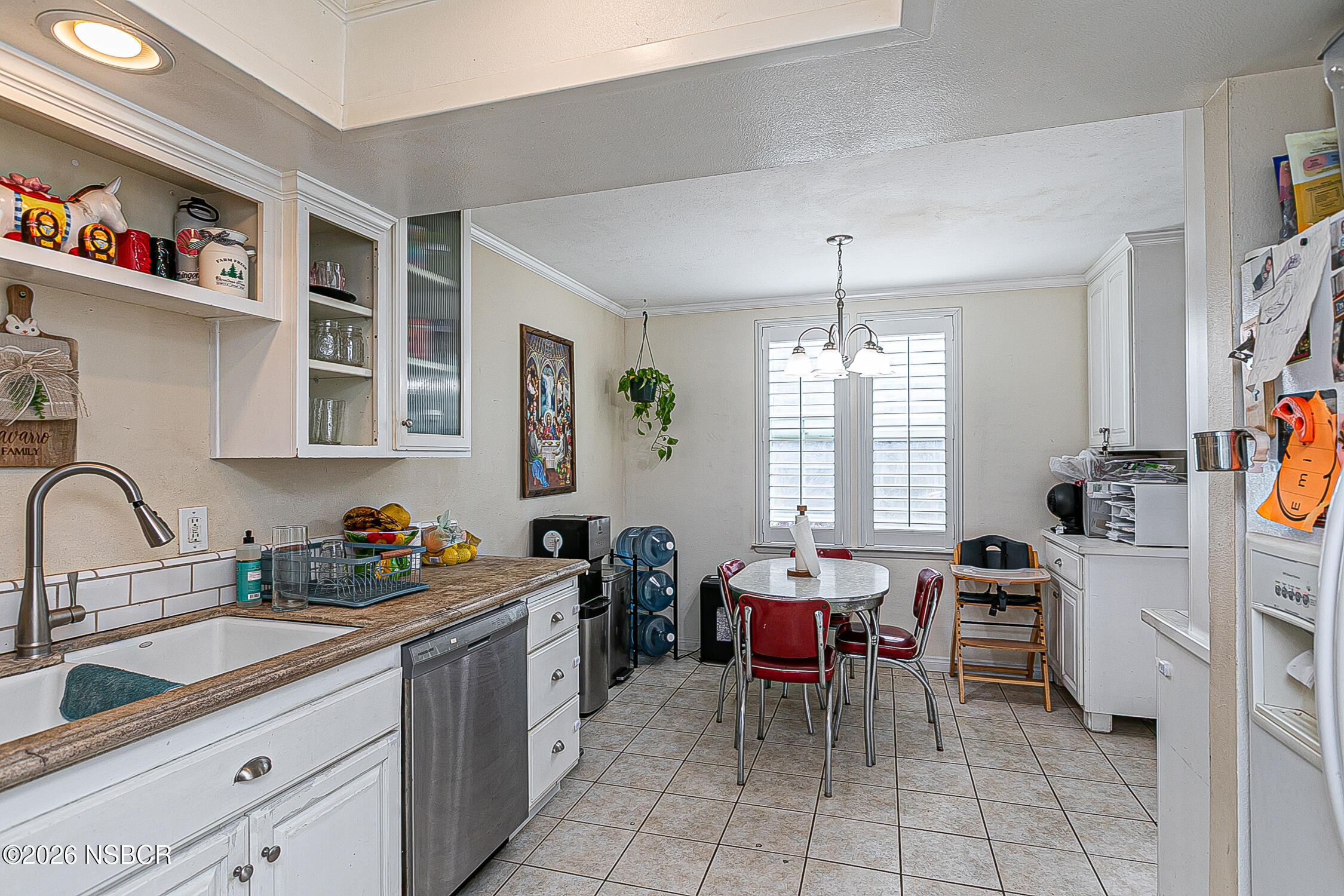 712 Pebble Beach Place Santa Maria, CA 93454 - Photo 9 of 31 a kitchen that has a lot of cabinets in it and appliances