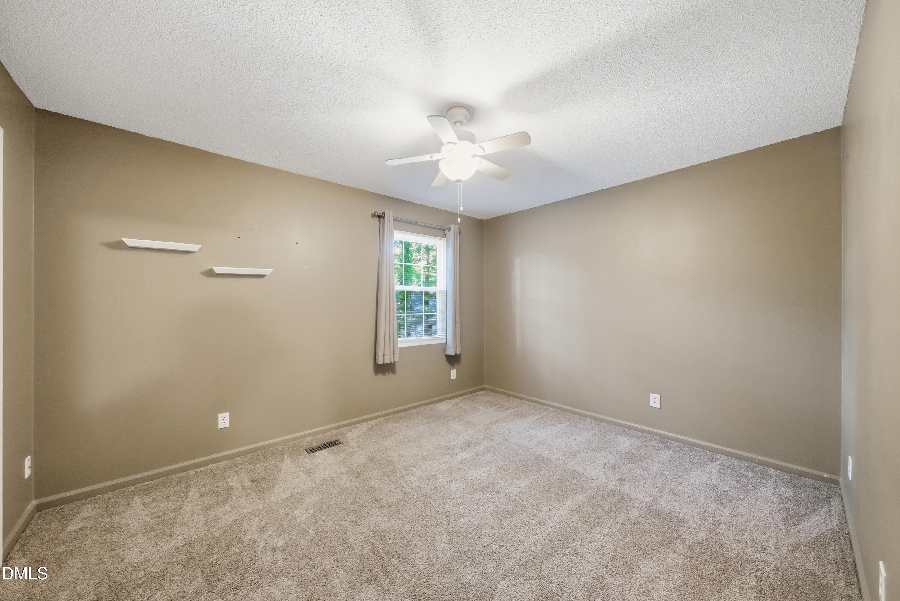6355 New Market Way Raleigh, NC 27615 - Photo 22 of 30 a view of an empty room with a window