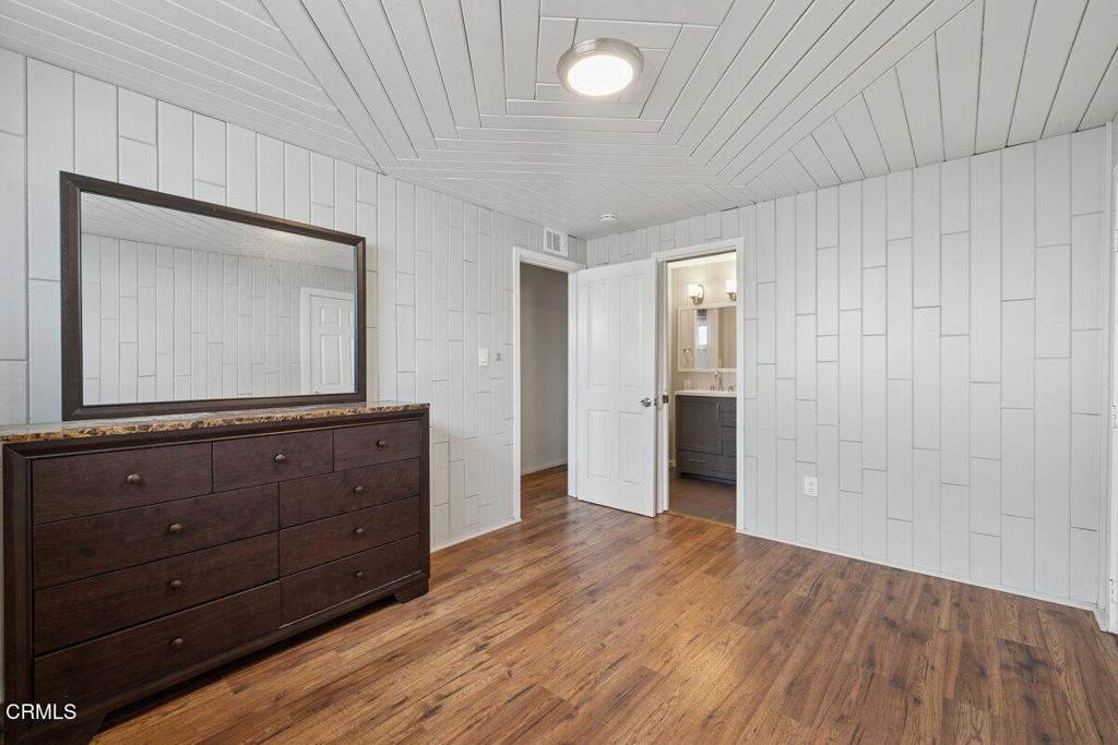 1841 South F Street Oxnard, CA 93033 - Photo 14 of 27 a view of room with wooden floor cabinet and mirror