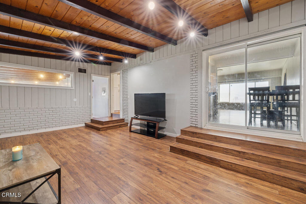 1841 South F Street Oxnard, CA 93033 - Photo 18 of 27 a view of a room with wooden floor and stairs