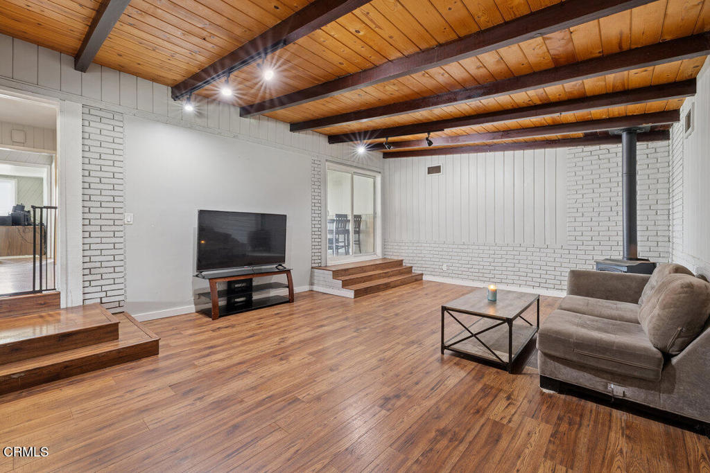 1841 South F Street Oxnard, CA 93033 - Photo 20 of 27 a living room with furniture and a flat screen tv