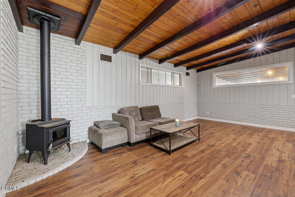 1841 South F Street Oxnard, CA 93033 - Photo 21 of 27 a living room with furniture and a wooden floor