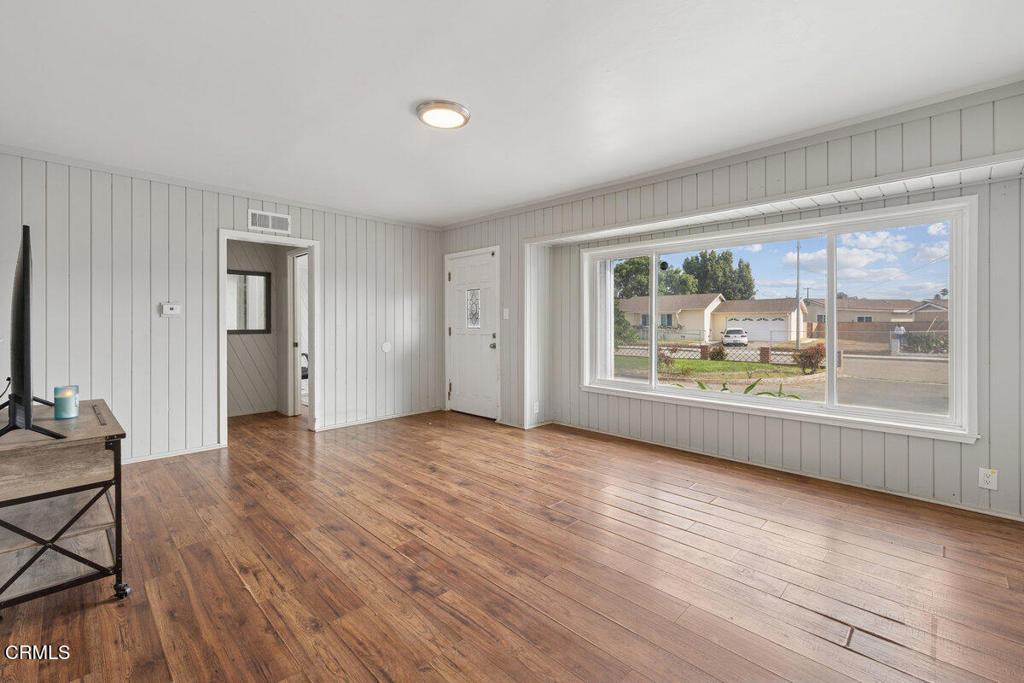 1841 South F Street Oxnard, CA 93033 - Photo 3 of 27 an empty room with wooden floor and windows