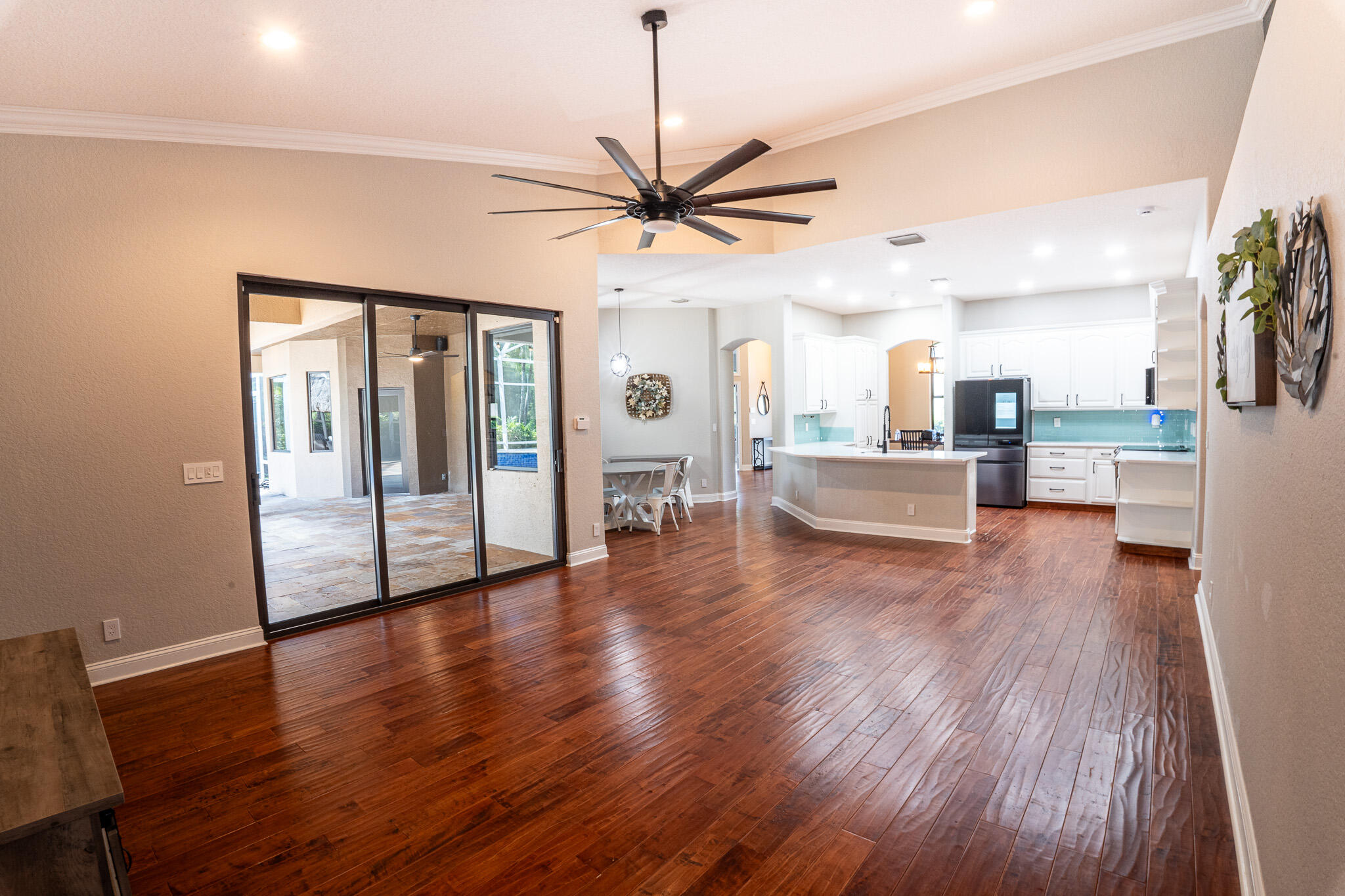 3516 185th Trail Loxahatchee, FL 33470 - Photo 11 of 56 a view of a livingroom with hardwood floor and a ceiling fan